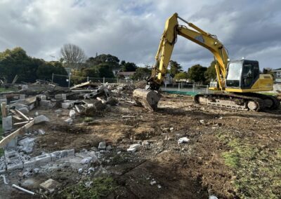 digger clearing land auckland